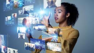 woman-looks-at-digital-imagery-nft-non-fungible-token-concept_iStock-1321462129.jpg